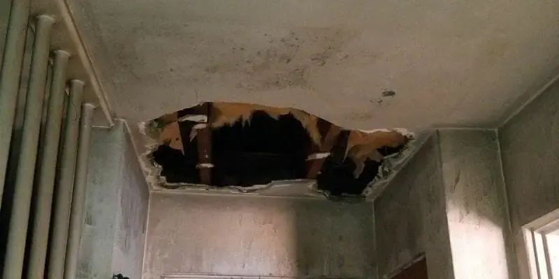 Ceiling opened below a storm roof leak in an Alhambra home