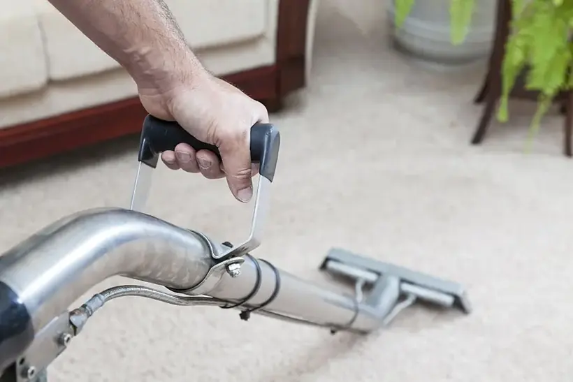 Extraction wand pulling water out of wet carpet in an Alhambra home